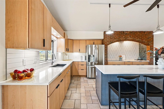 8090 Newton St, Westminster, CO 80031 - kitchen with a sink, appliances with stainless steel finishes, light countertops, and tasteful backsplash