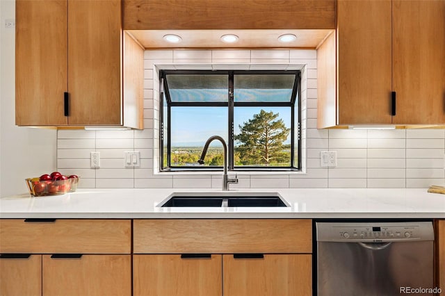 8090 Newton St, Westminster, CO 80031 - kitchen featuring stainless steel dishwasher, a sink, light countertops, and decorative backsplash