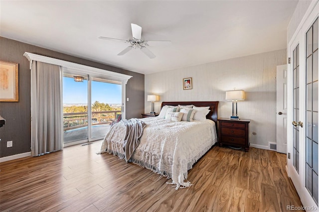 8090 Newton St, Westminster, CO 80031 - bedroom featuring access to outside, wood finished floors, and baseboards