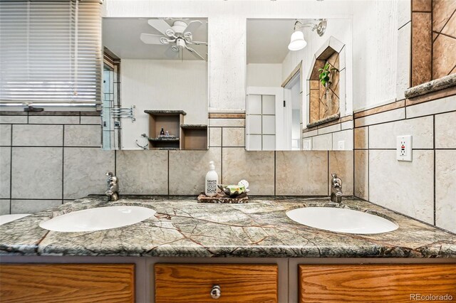 8090 Newton St, Westminster, CO 80031 - bathroom with a ceiling fan, backsplash, and double vanity