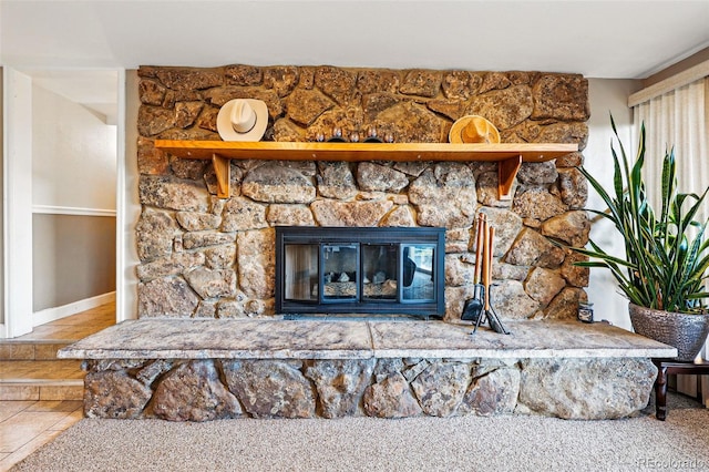 8090 Newton St, Westminster, CO 80031 - detailed view of a stone fireplace and baseboards