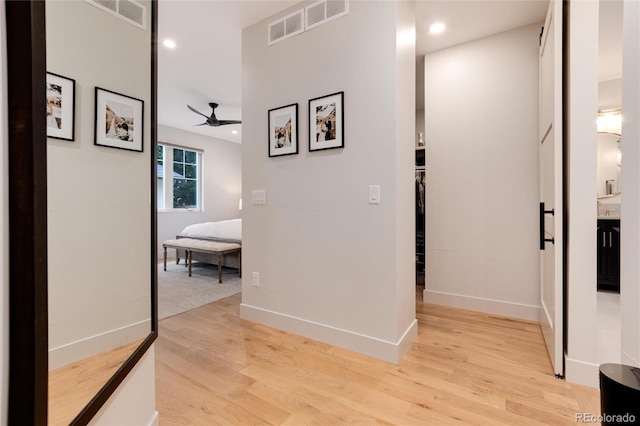 4711 S Logan St, Englewood, CO 80113 - corridor featuring light wood-type flooring, recessed lighting, and baseboards