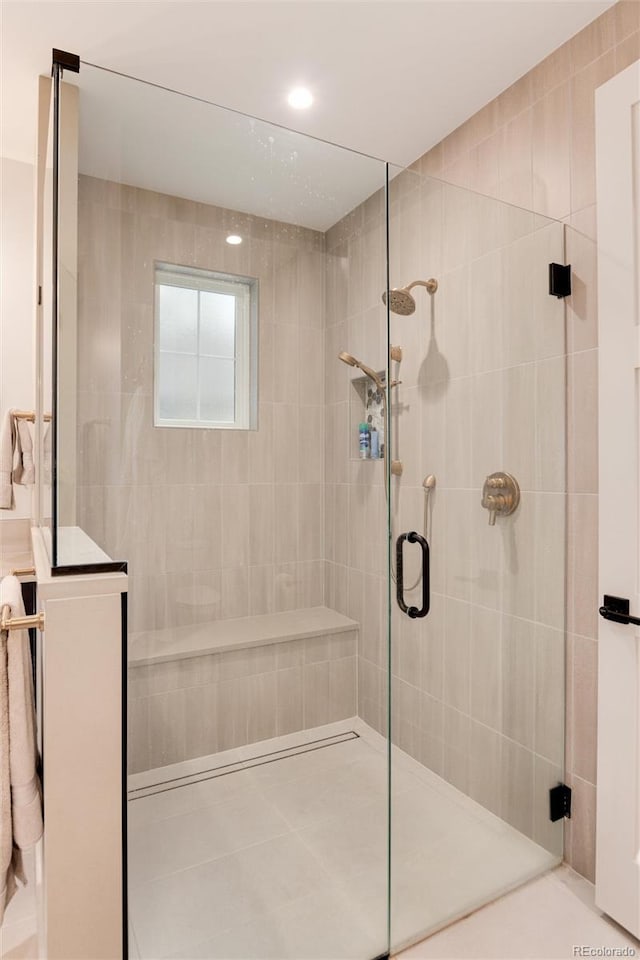 4711 S Logan St, Englewood, CO 80113 - full bath featuring tiled shower, tile patterned floors, and recessed lighting