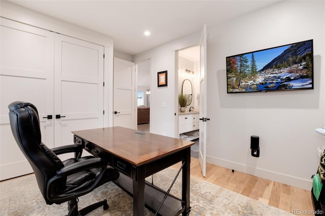 4711 S Logan St, Englewood, CO 80113 - office area with light wood finished floors, recessed lighting, and baseboards