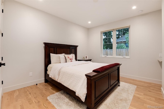 4711 S Logan St, Englewood, CO 80113 - bedroom with light wood-style flooring, baseboards, and recessed lighting