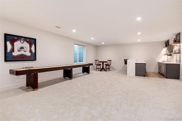 4711 S Logan St, Englewood, CO 80113 - rec room featuring light colored carpet, recessed lighting, baseboards, and a sink