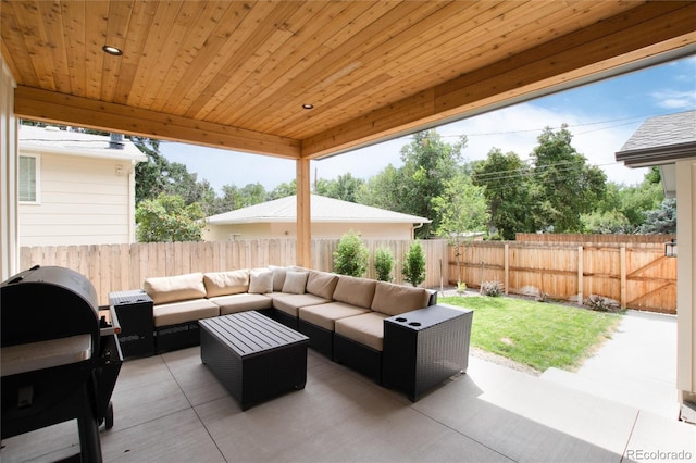 4711 S Logan St, Englewood, CO 80113 - fenced backyard featuring outdoor lounge area, a patio, and a grill