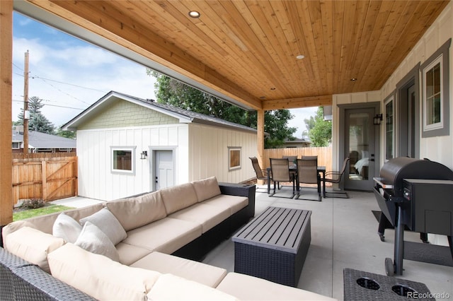 4711 S Logan St, Englewood, CO 80113 - fenced backyard featuring outdoor dining area, outdoor lounge area, and a patio