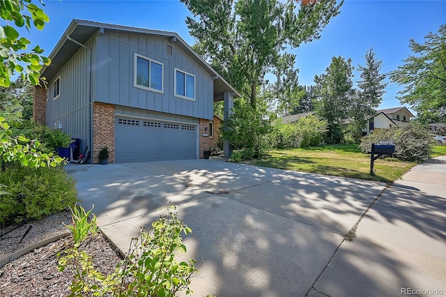 view of home's exterior featuring a yard and a garage