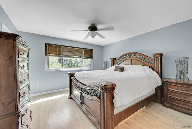 bedroom with light wood-type flooring and ceiling fan