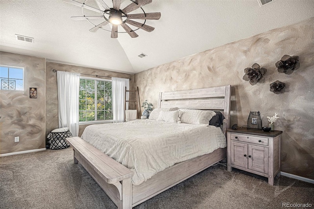 bedroom featuring dark colored carpet, baseboards, a textured ceiling, and vaulted ceiling