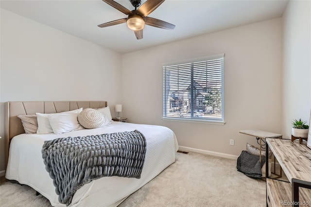 bedroom with baseboards, ceiling fan, and carpet flooring