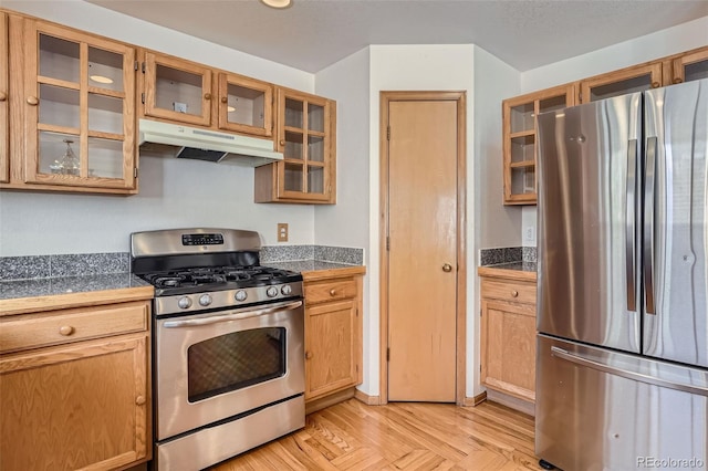 kitchen with light parquet flooring and stainless steel appliances