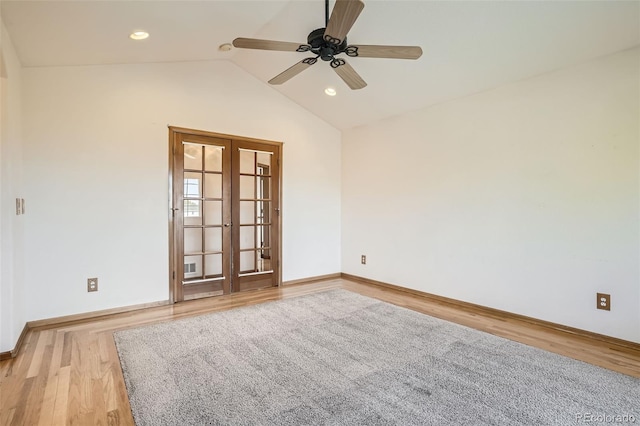 unfurnished room featuring french doors, vaulted ceiling, light wood-type flooring, and ceiling fan