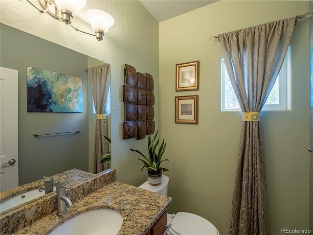 1033 H St, Salida, CO 81201 - half bathroom featuring toilet and vanity