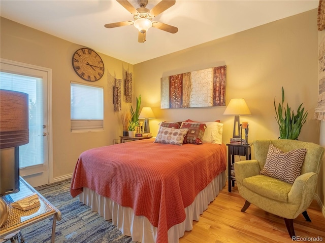 1033 H St, Salida, CO 81201 - bedroom featuring wood finished floors, ceiling fan, and access to outside