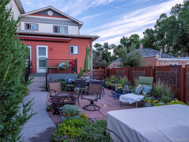 1033 H St, Salida, CO 81201 - view of patio / terrace with an outdoor fire pit