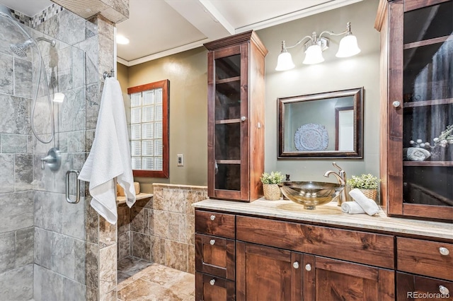 full bath with tile walls, crown molding, a shower stall, and vanity