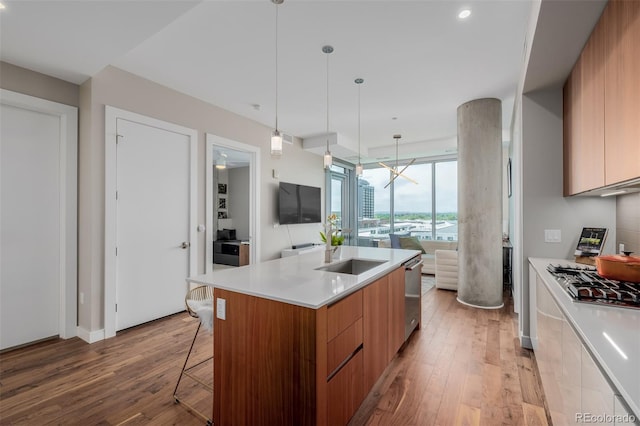 4200 W 17th Ave Unit 625, Denver, CO 80204 - kitchen with modern cabinets, light wood-style flooring, light countertops, and a wall of windows