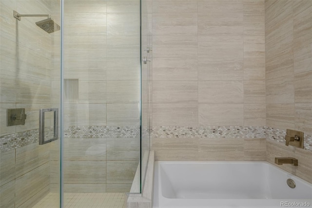 4200 W 17th Ave Unit 625, Denver, CO 80204 - bathroom with tiled shower and a bathtub