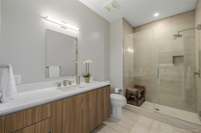 4200 W 17th Ave Unit 625, Denver, CO 80204 - bathroom with vanity, a shower stall, and tile patterned floors