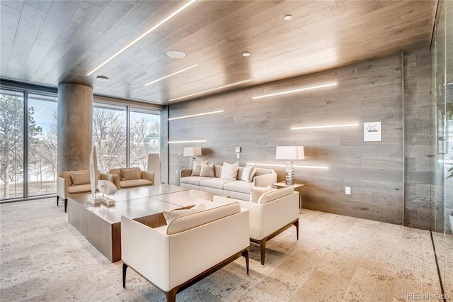 4200 W 17th Ave Unit 625, Denver, CO 80204 - living room featuring wooden ceiling, healthy amount of natural light, expansive windows, and wooden walls