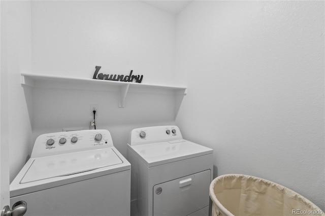 laundry area with laundry area and separate washer and dryer