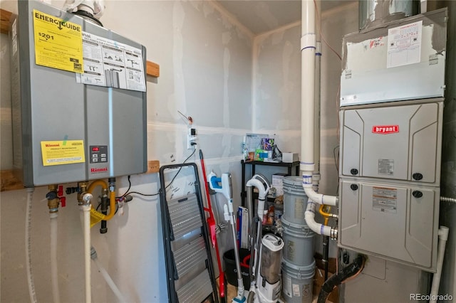 utility room with water heater and heating unit