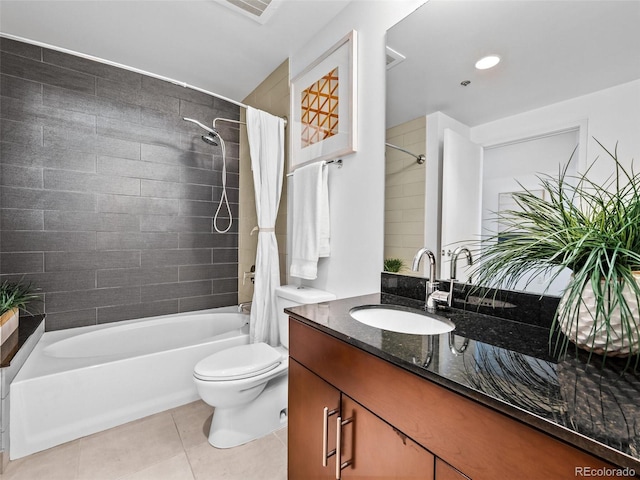 full bathroom featuring toilet, shower / bath combo with shower curtain, vanity, and tile patterned flooring