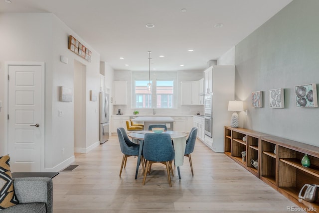 2282 Old Rail Way, Superior, CO 80027 - dining area featuring light wood-style floors and recessed lighting