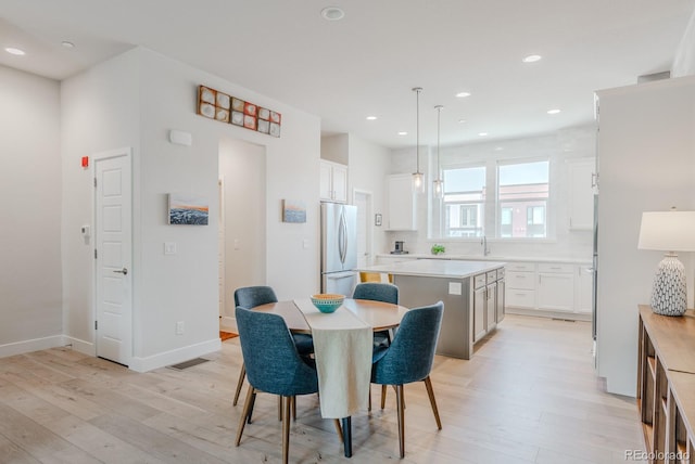2282 Old Rail Way, Superior, CO 80027 - dining area with light wood finished floors and recessed lighting