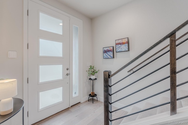 2282 Old Rail Way, Superior, CO 80027 - entrance foyer featuring light wood-style floors and stairs