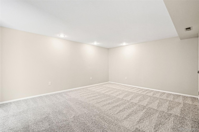 carpeted empty room with recessed lighting and baseboards