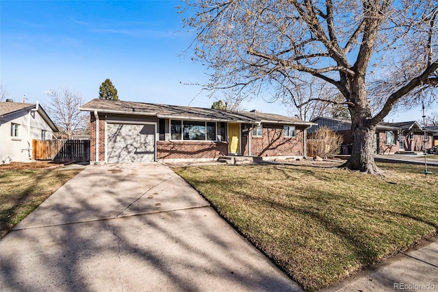 ranch-style home with brick siding, fence, concrete driveway, a front yard, and an attached garage