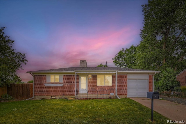 11891 Gaylord Way, Northglenn, CO 80233 - view of front of home with brick siding, concrete driveway, a garage, and a chimney