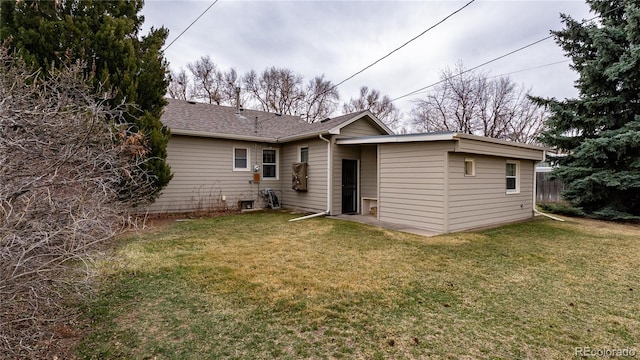 4115 S Clarkson St, Englewood, CO 80113 - rear view of house featuring a shingled roof and a yard