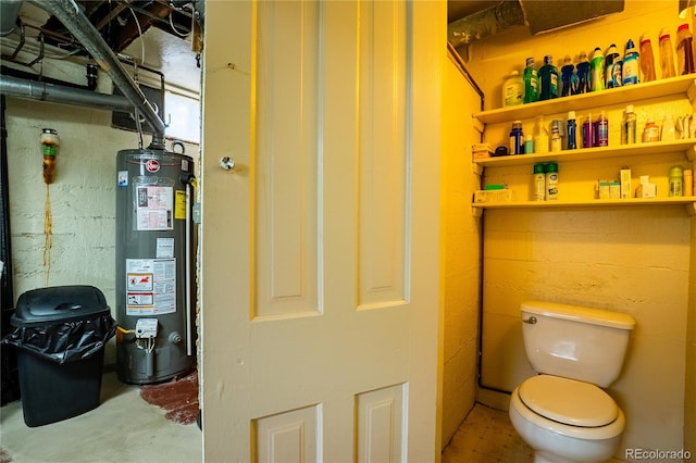 4115 S Clarkson St, Englewood, CO 80113 - interior space featuring concrete floors, gas water heater, and toilet