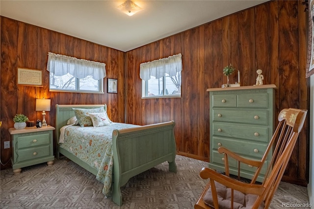 4115 S Clarkson St, Englewood, CO 80113 - carpeted bedroom featuring wood walls and multiple windows