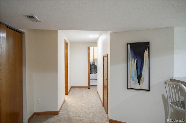 9927 Aftonwood St, Highlands Ranch, CO 80126 - hall featuring washer / clothes dryer and baseboards