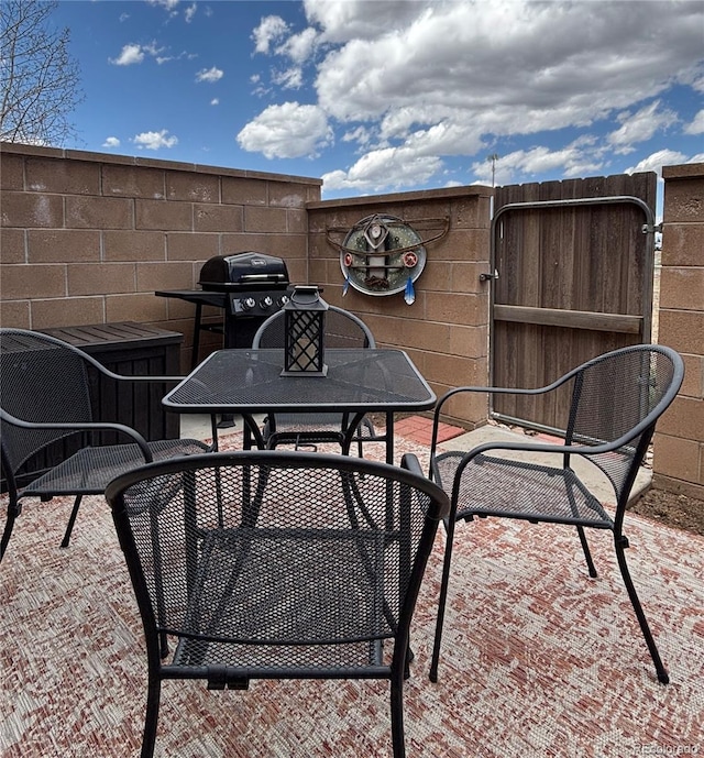 9 Granada Ct Unit 15, Westcliffe, CO 81252 - view of patio with a grill and outdoor dining area