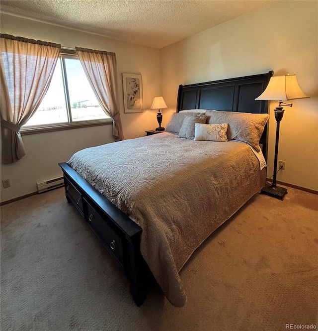 9 Granada Ct Unit 15, Westcliffe, CO 81252 - carpeted bedroom featuring a textured ceiling, baseboards, and a baseboard heating unit