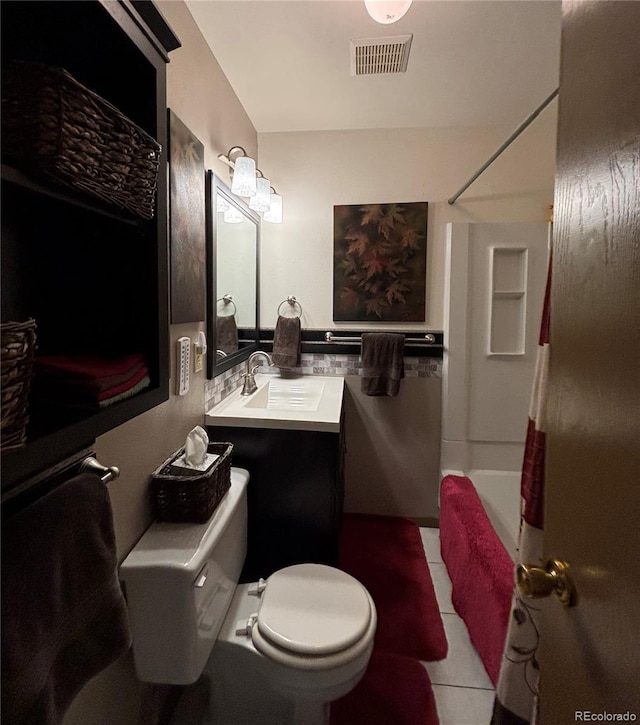 9 Granada Ct Unit 15, Westcliffe, CO 81252 - bathroom featuring toilet, shower / bath combo with shower curtain, vanity, and tile patterned flooring