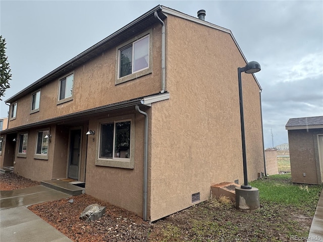 9 Granada Ct Unit 15, Westcliffe, CO 81252 - rear view of house featuring stucco siding