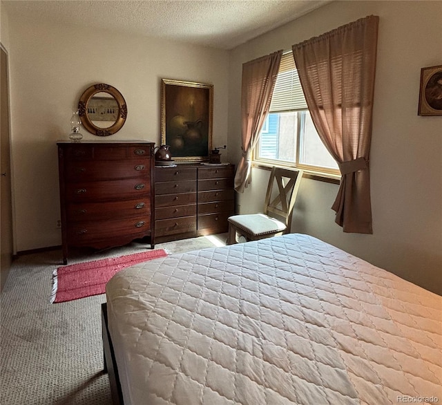 9 Granada Ct Unit 15, Westcliffe, CO 81252 - bedroom featuring a textured ceiling and carpet