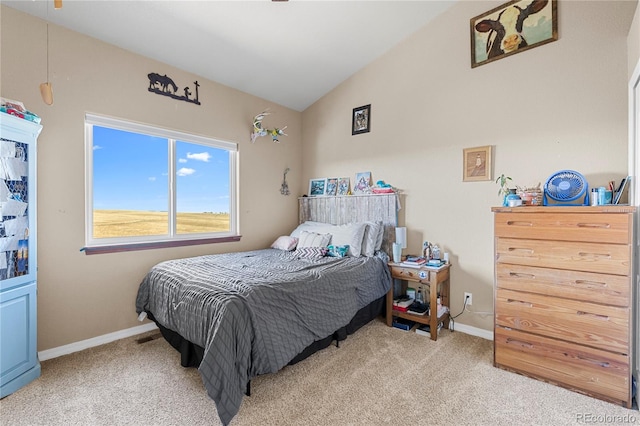 carpeted bedroom featuring vaulted ceiling