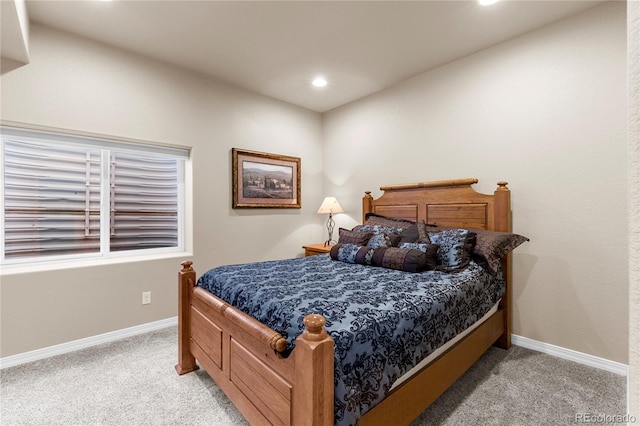 bedroom featuring light carpet