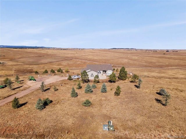 birds eye view of property with a rural view