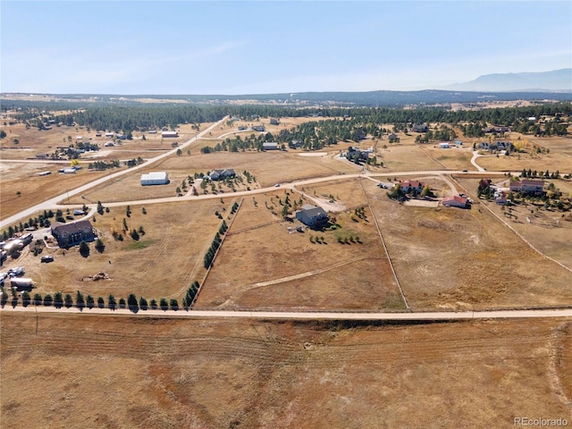 aerial view featuring a mountain view and a rural view