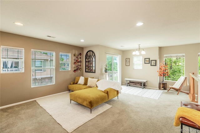 9760 Mayfair St Unit A, Englewood, CO 80112 - living area with light colored carpet, plenty of natural light, a chandelier, and recessed lighting
