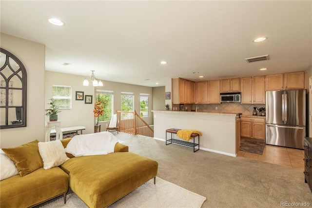 9760 Mayfair St Unit A, Englewood, CO 80112 - living room with recessed lighting, light carpet, and a chandelier
